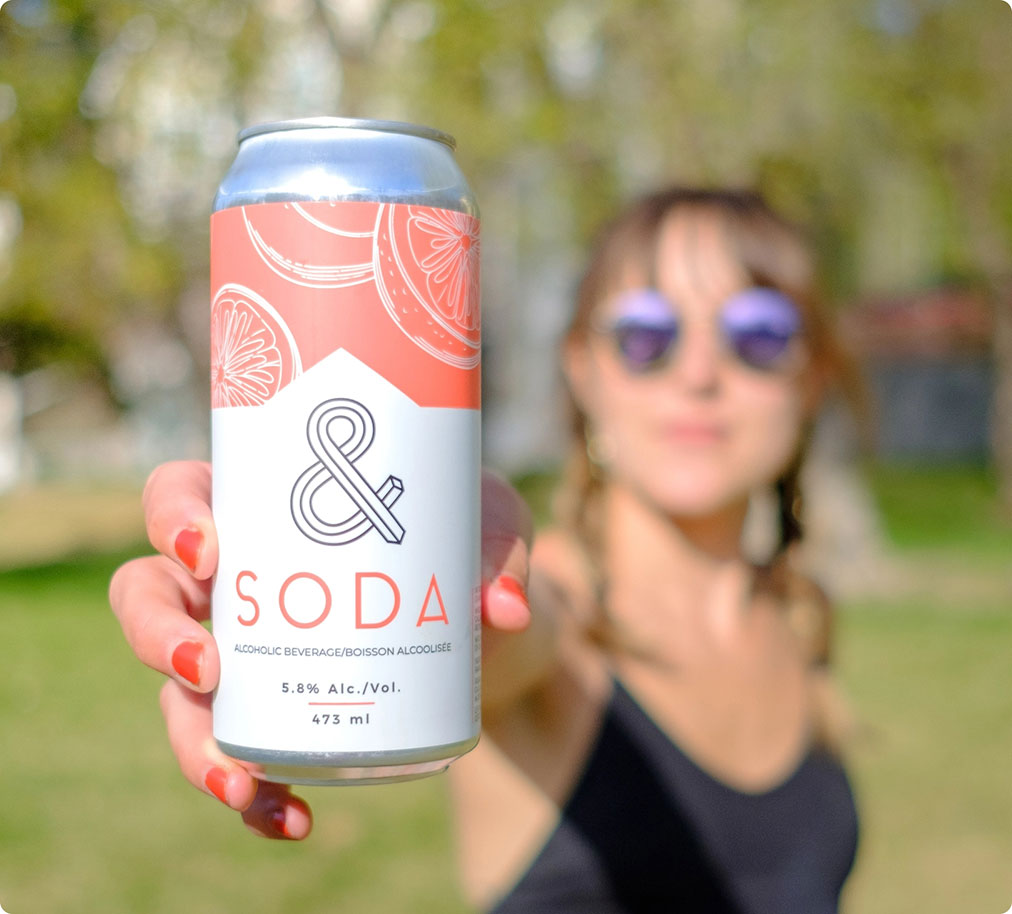 Girl showing soda can